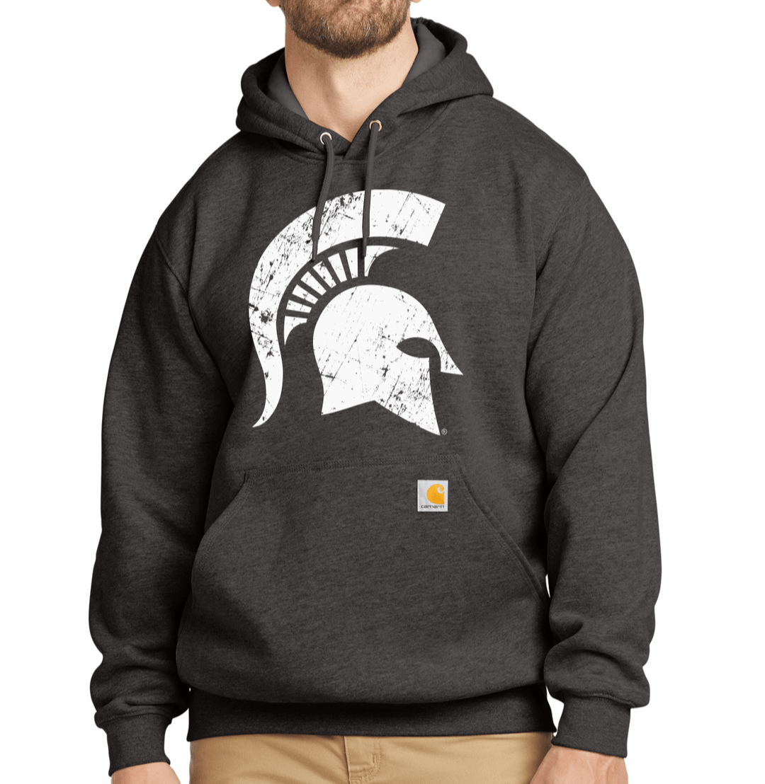 Man wearing charcoal grey Michigan State University Carhartt hoodie with large white Spartan helmet logo on chest, front view showing loose fit and rugged style