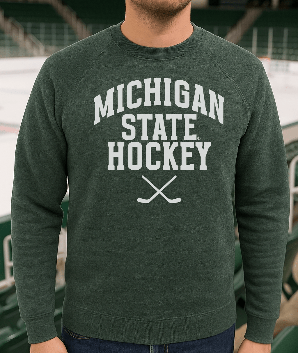 Michigan State Hockey Sticks Green Sweatshirt on male model in ice arena