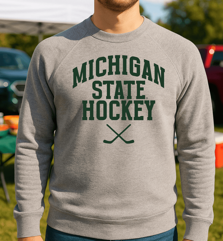 Michigan State Hockey Sticks Grey Sweatshirt on male model at outdoor tailgate