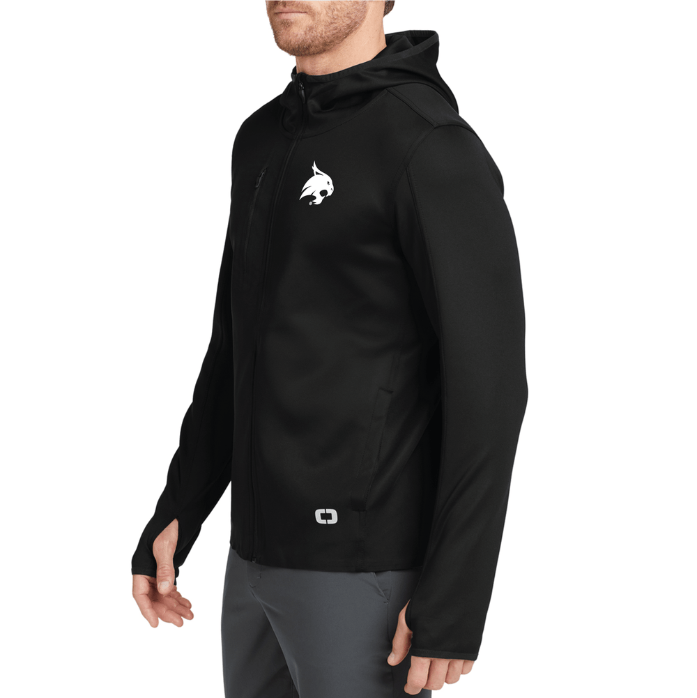 Male model wearing a black Texas State performance OGIO jacket with a white bobcat embroidered on the left chest.