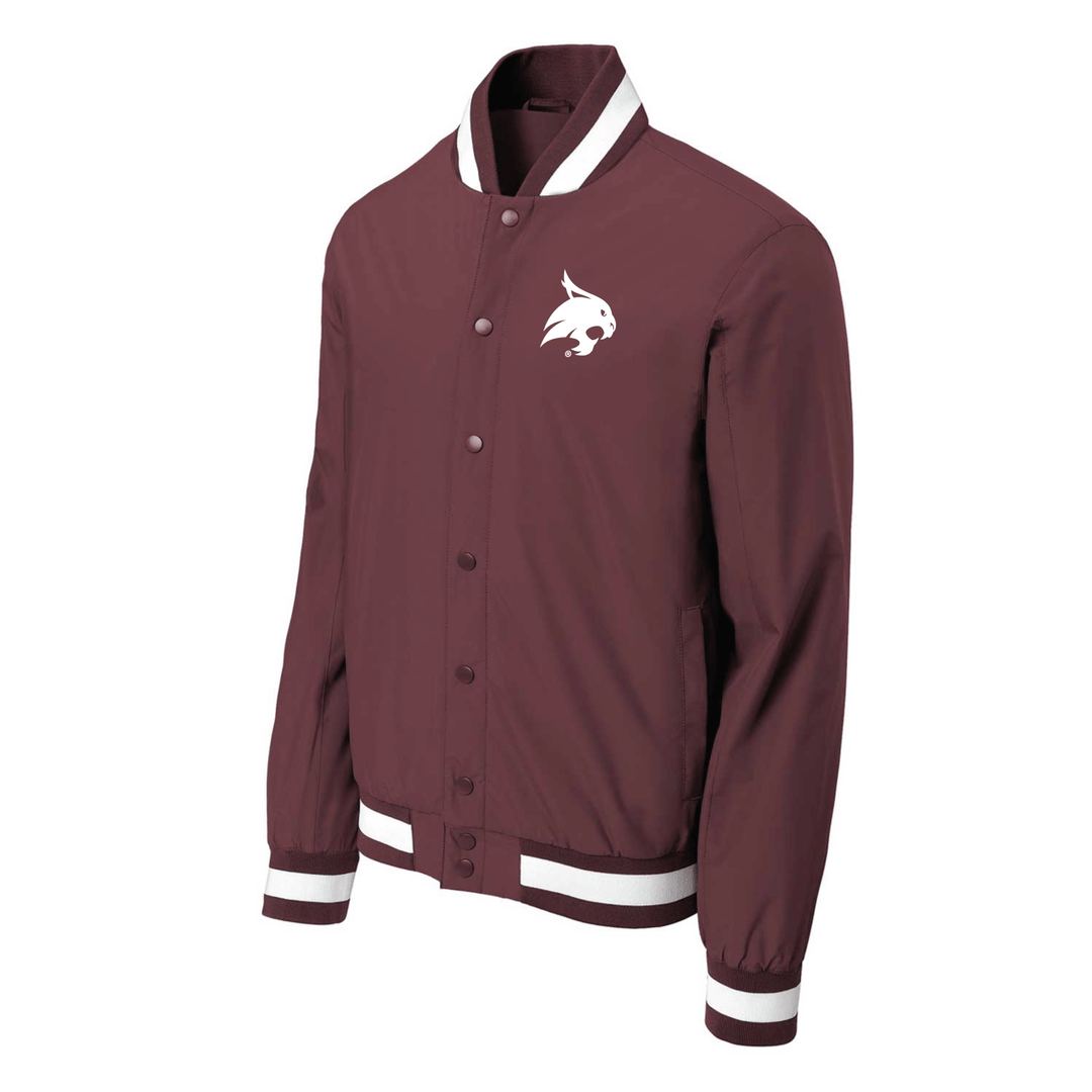 Angled view of a maroon Texas State varsity jacket with the bobcat logo embroidered in white thread on the left chest.