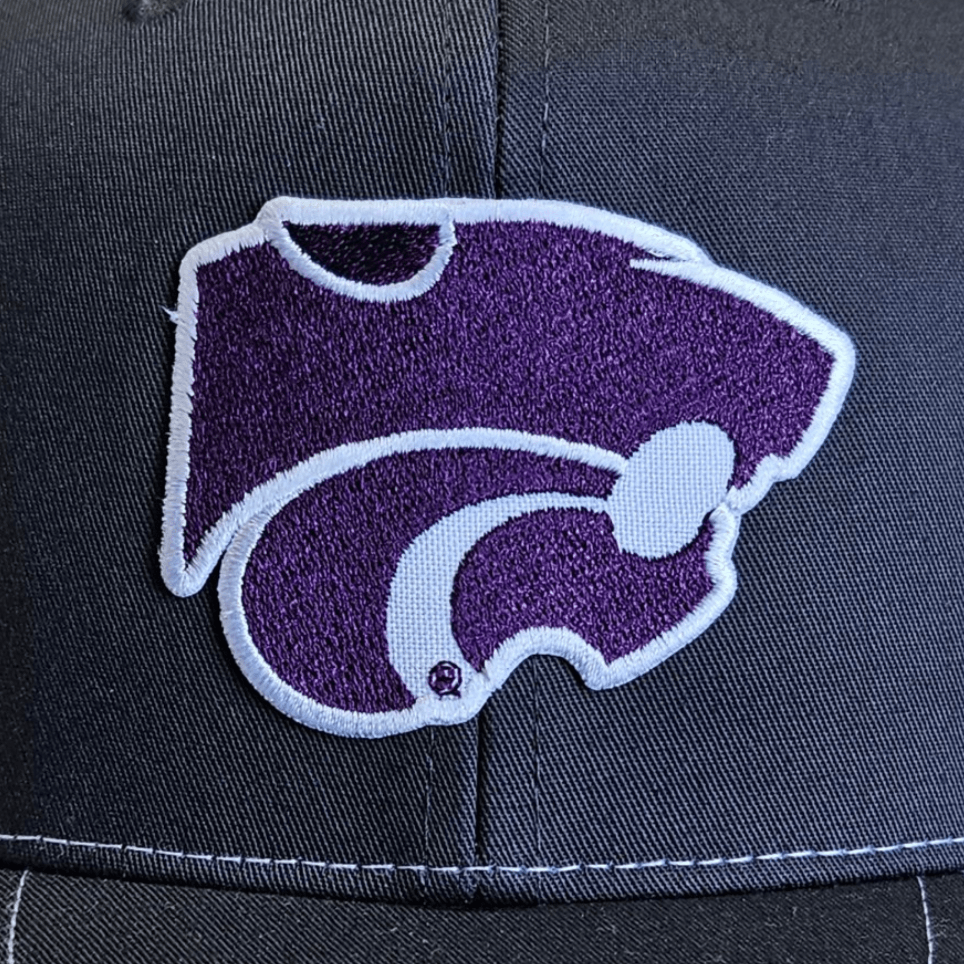Zoomed in up close view of Kansas State University Powercat Logo Trucker Hat