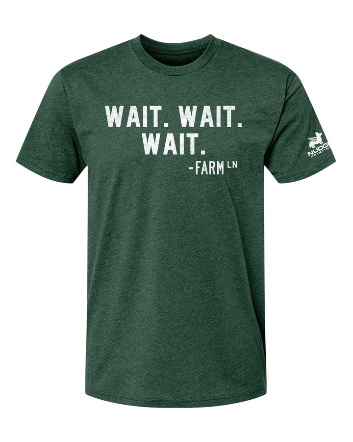 Green t-shirt featuring "Wait. Wait. Wait." a quote from the Farm Lane walk sign in East Lansing. Soft and comfortable cotton polyester blend material.