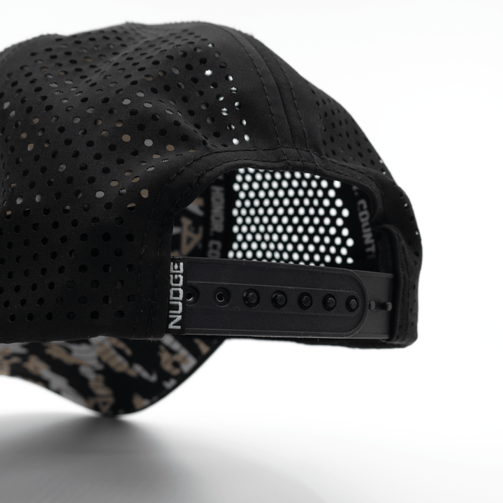 Back view of the performance Black Knights West Point camo performance hat featuring a snapback closure and custom camo pattern.