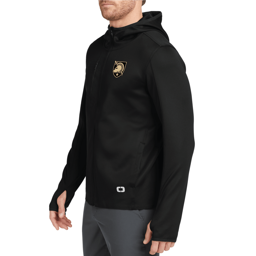 Male model wearing a black West Point OGIO performance Stealth jacket with the shield logo embroidered on the left chest.