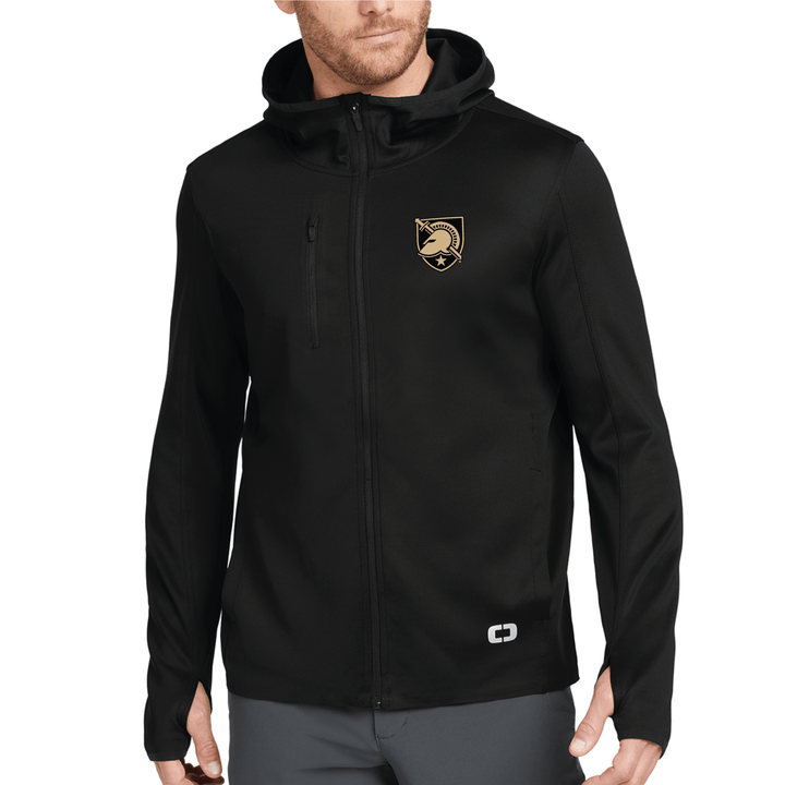 Model wearing a black West Point performance jacket from OGIO with the shield logo embroidered on the left chest.