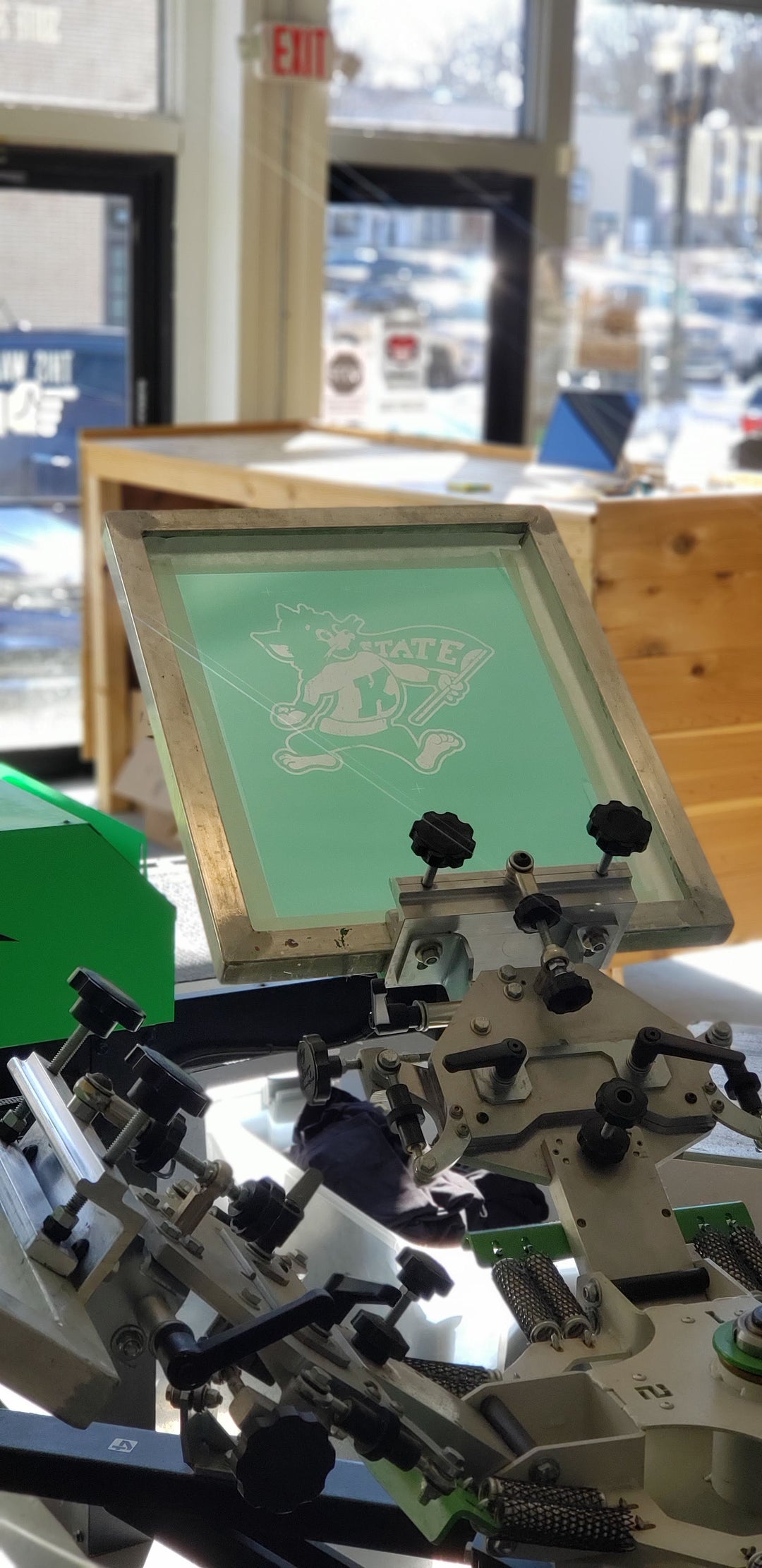 Grey Willie the Wildcat T Shirt being printed
