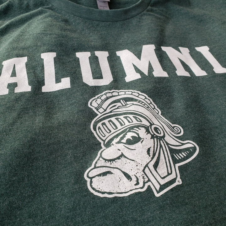 Close up of Gruff Sparty Alumni design printed on a green Michigan State T Shirt