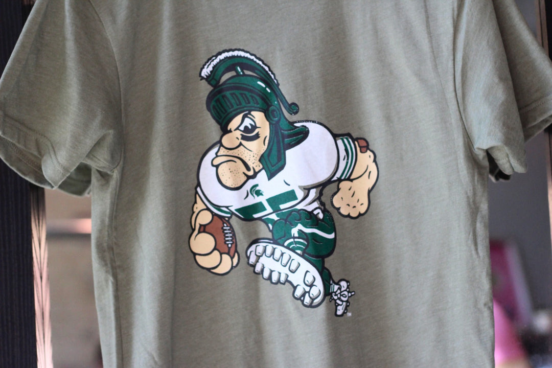 Green Michigan State Gruff Sparty Football Shirt on hanger