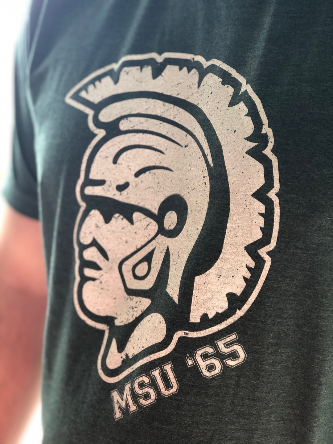 Close up of 1965 Spartan Helmet Michigan State T Shirt