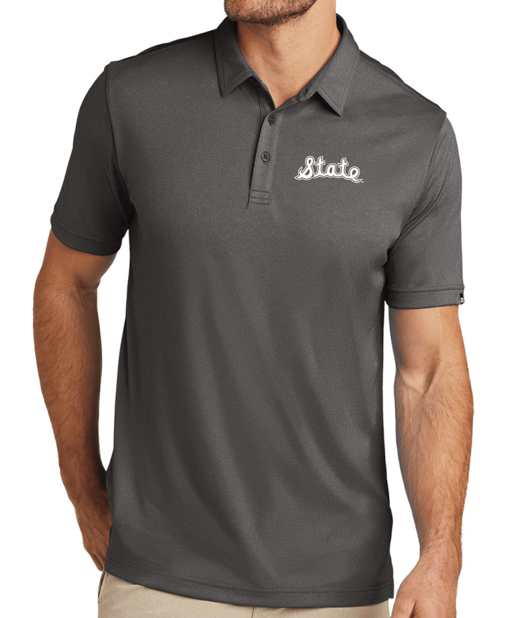 Travis Mathew Michigan State Grey Polo State Script logo on model