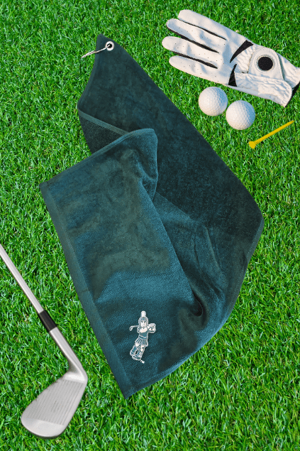 Michigan State Green Golf Towel with Golfing Swinging Sparty in corner on grass with club, glove and golf balls and a tee 