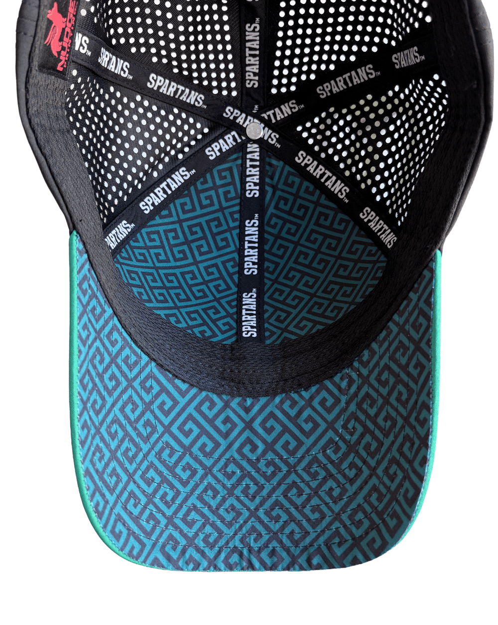 Inside view of Michigan State hat showing teal underbill with dark Greek key geometric pattern, black Spartans seam tape, and black perforated mesh interior.
