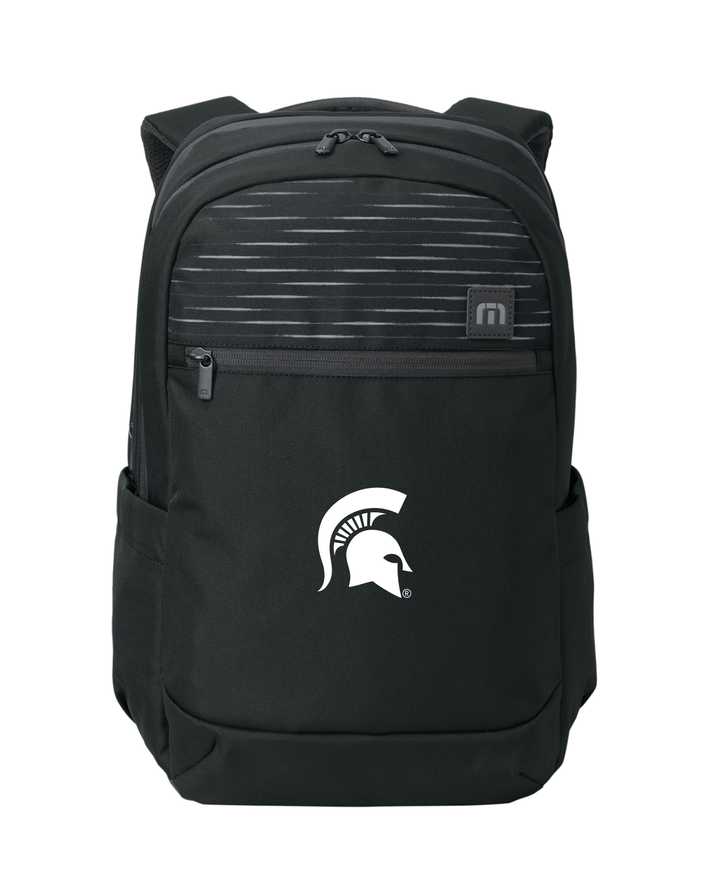 Black Travis Mathew backpack for Michigan State University sporting a white embroidered Spartan Helmet logo