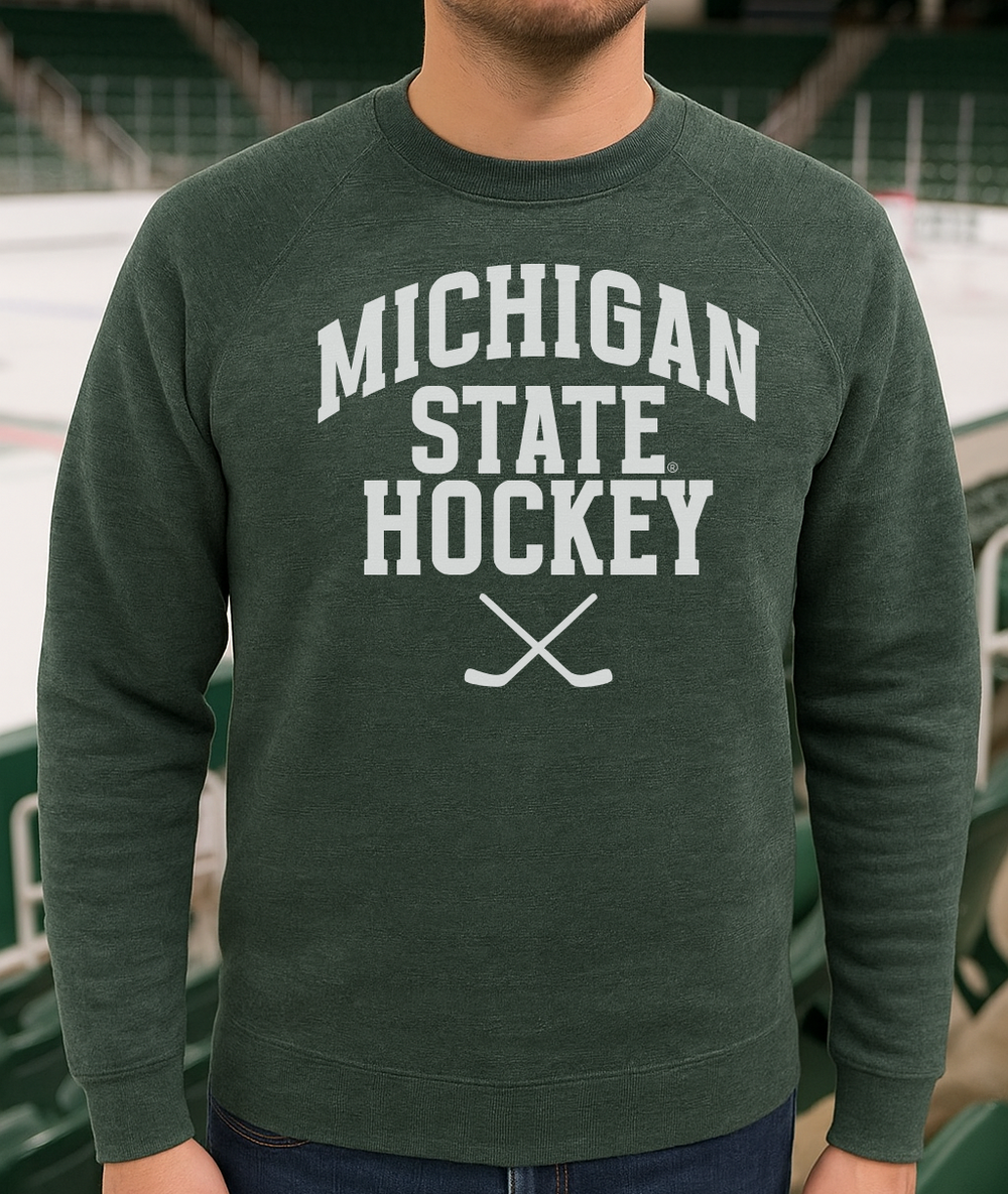 Michigan State Hockey Sticks Green Sweatshirt on male model in ice arena