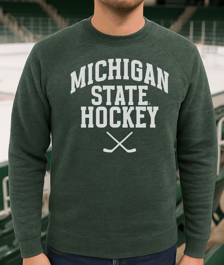 Michigan State Hockey Sticks Green Sweatshirt on male model in ice arena