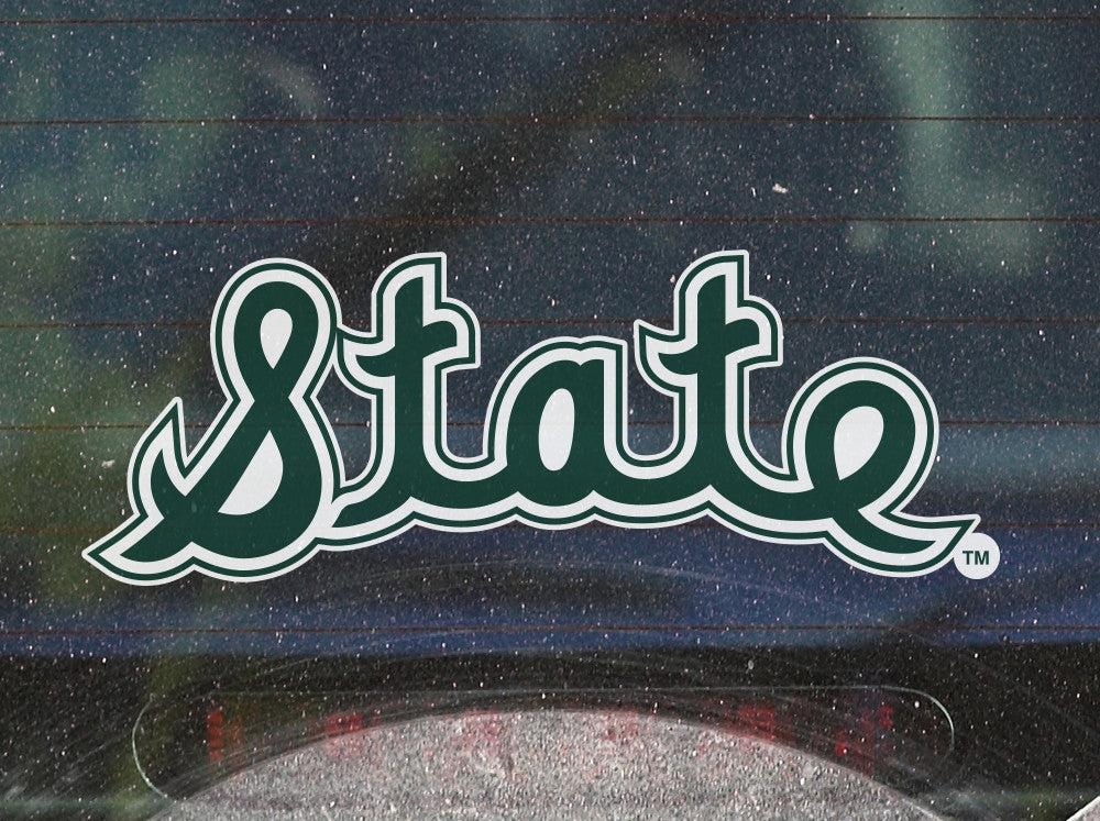 Michigan State Script Vintage Car Decal on the back of a dirty car