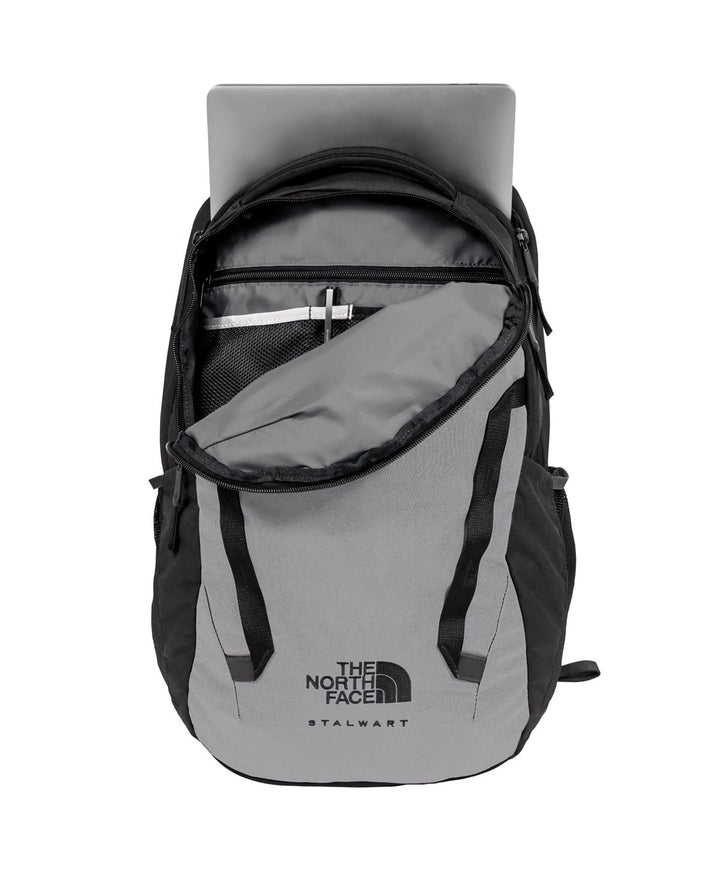 Front view of a grey opened North Face Stalwart backpack showing the inside compartments. 