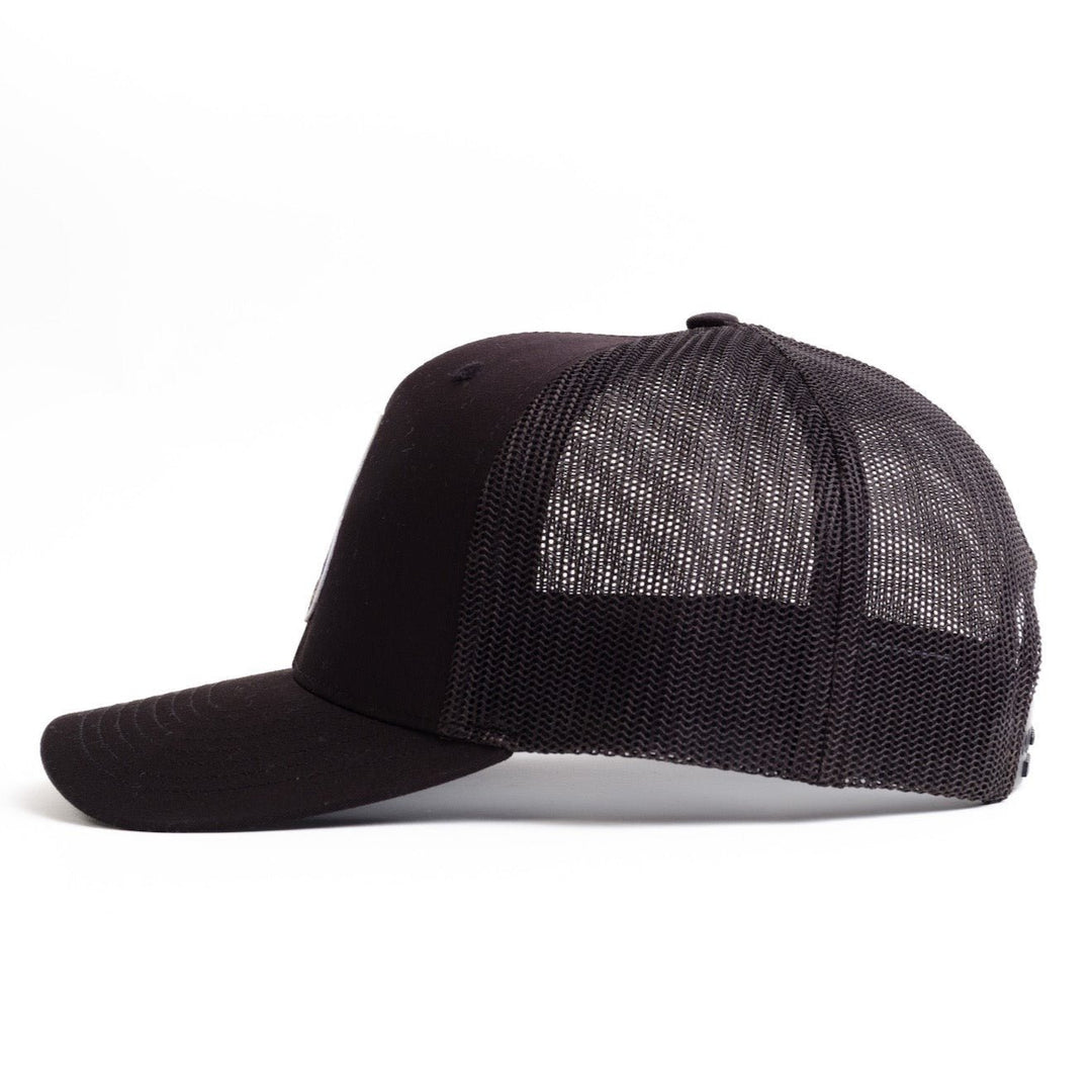 Left side of black Trucker hat from Nudge printing