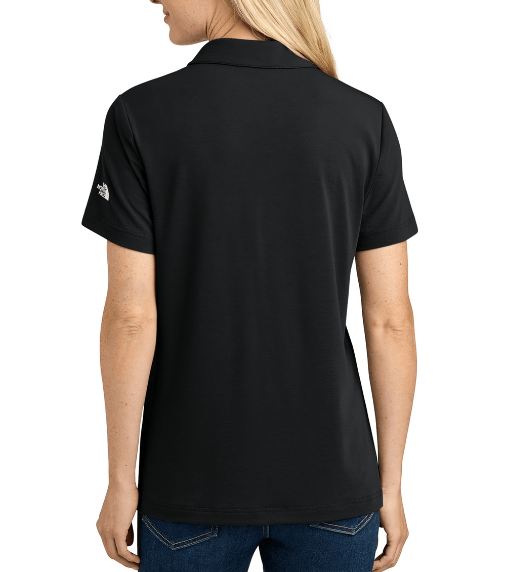 Backside of black Michigan State Construction Management button up women's polo. 