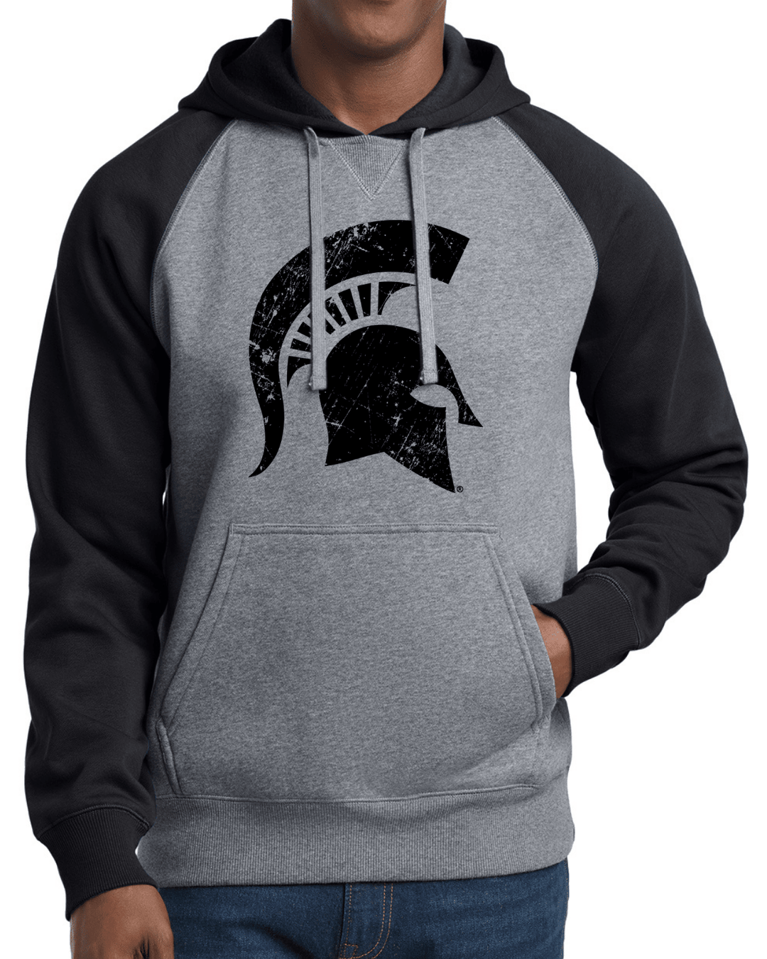 Frontside shot of male model wearing heavyweight Michigan State hoodie sweatshirt with MSU Spartan helmet design printed across chest.