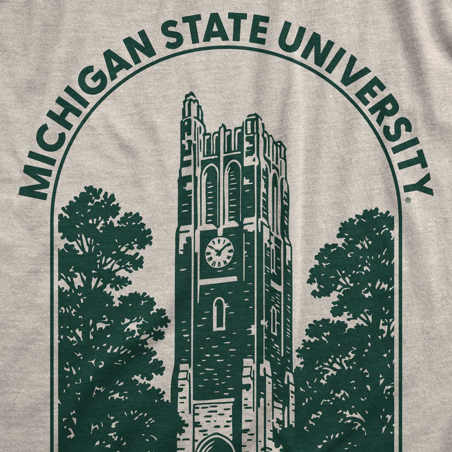 Close up view of Michigan State shirt with green Beaumont Tower design . 