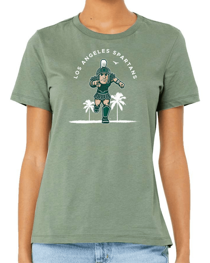 Woman wearing light green Michigan State shirt with Los Angeles Spartans design on chest.
