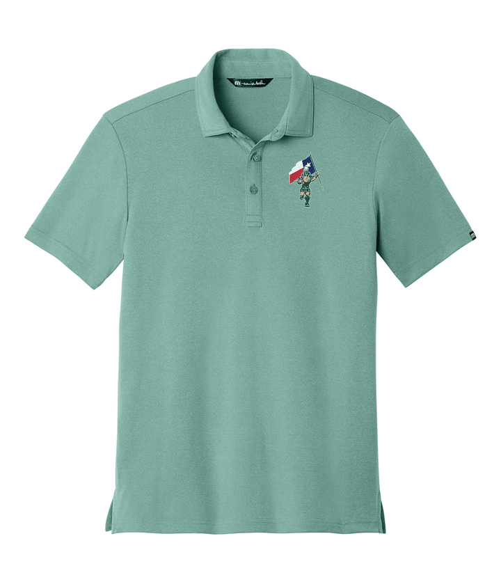 A mint green short-sleeve polo shirt with a small embroidered graphic on the left chest depicting Michigan State Sparty carrying a Texas flag, shown on a plain white background.