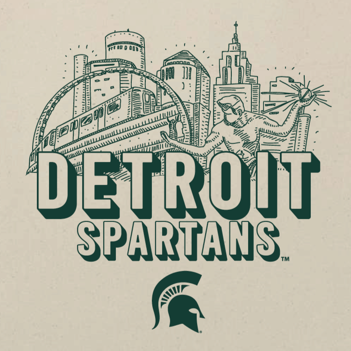 Close up view of a Michigan State tote bag printed with the Detroit Spartans logo in green ink. 