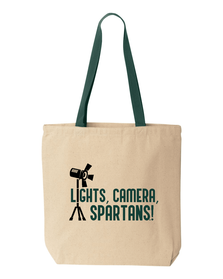 Beige Michigan State tote bag with the words "Lights, camera, Spartans!", and a green strap.