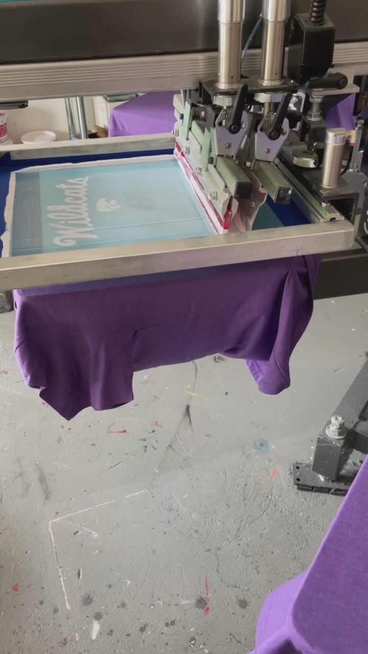 Kansas State University Wildcats Script K-State Lavender Light Purple Short Sleeve T-shirt being Printed on machine