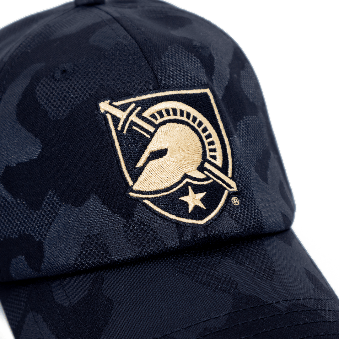 Close up view of West Point hat in black camo and embroidered Black Knights shield on the front. 