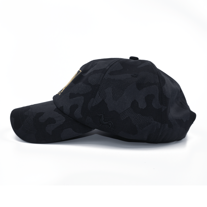 Left side view of a black camo West Point hat with curved bill and premium embroidered Black Knights logo on the front. 