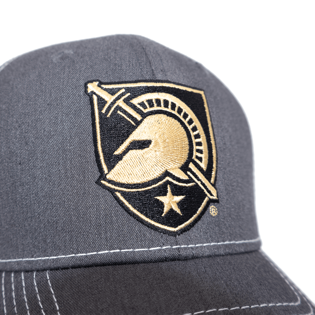 Close up view of West Point grey and white trucker hat with Black Knights shield logo embroidered on the front.
