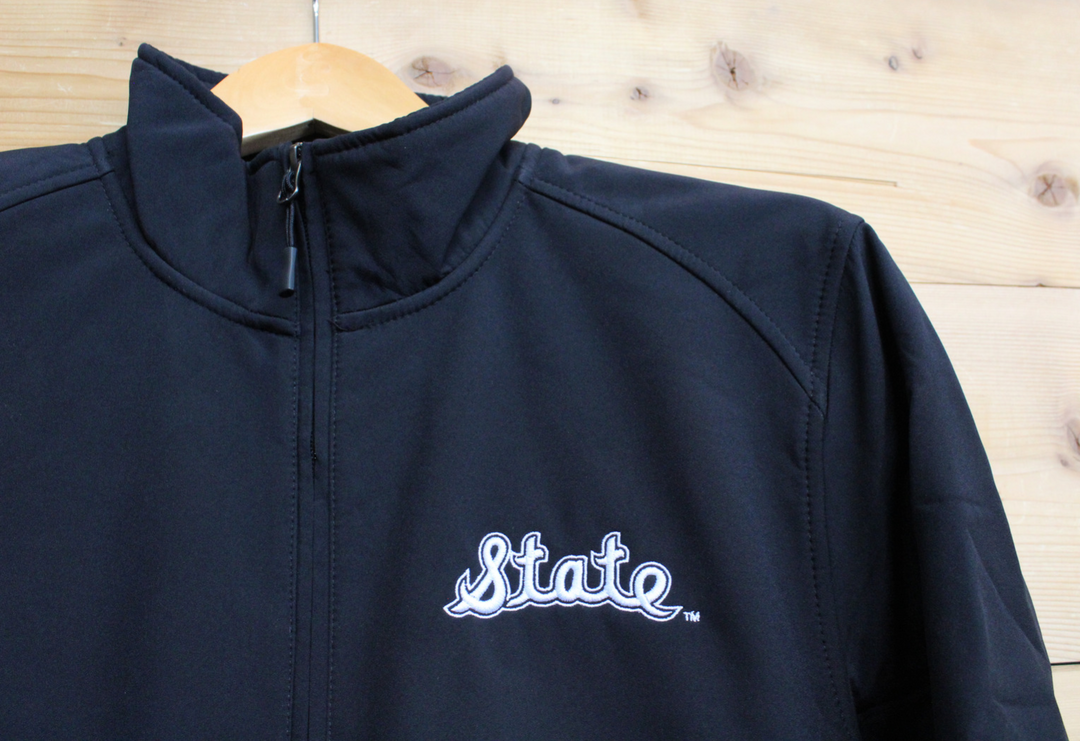 Close up of Michigan State bomber jacket with vintage State Script Embroidered logo