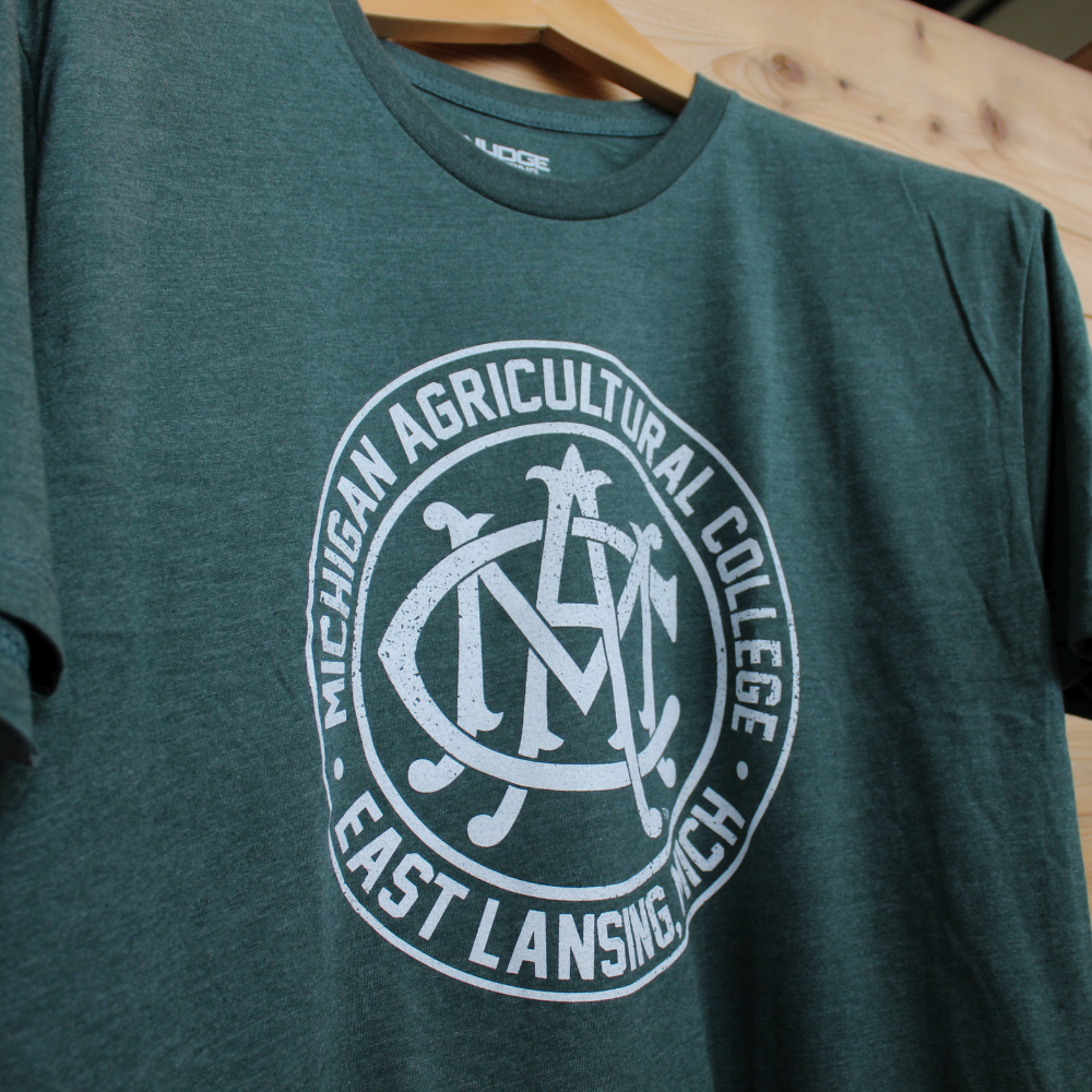 Close up of Green Michigan State University MAC T Shirt from Nudge Printing