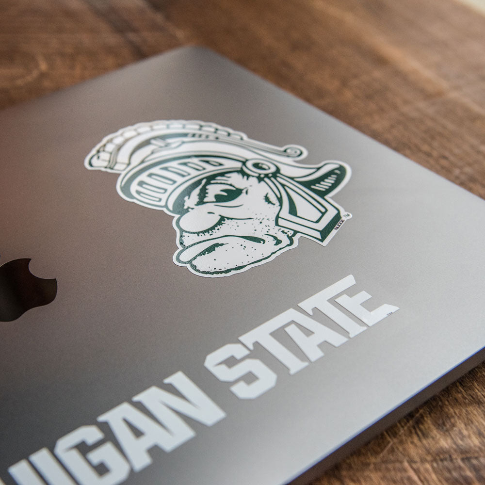 Lifestyle photo of a Gruff Sparty Decal on a Laptop