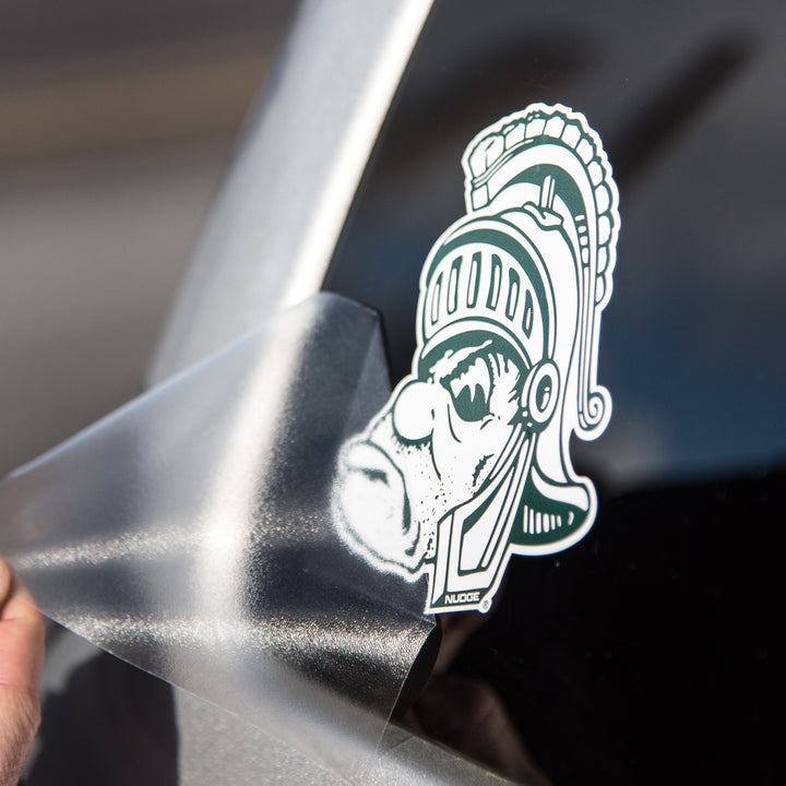 Vintage Michigan State Decal being installed