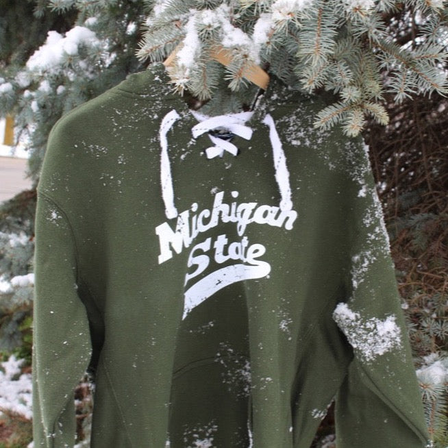 Lifestyle photo of Michigan State Hockey Hooded Sweatshirt from Nudge Printing